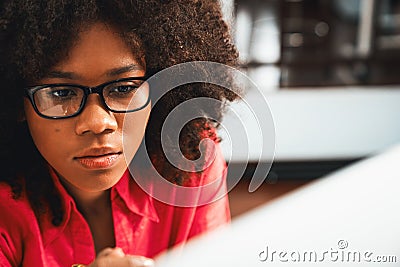 Portrait of young African American woman creating website developer. Tastemaker. Stock Photo