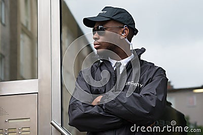 Security Guard Standing Arms Crossed Stock Photo