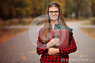 Portrait of young american university student smiling with takeaway coffee Stock Photo