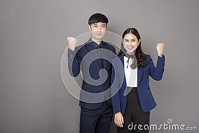 Portrait of young Asian confidence business people on gray background Stock Photo