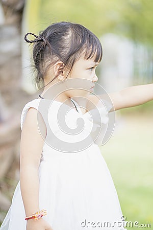 Portrait of a young Asian girl smiling at the camera - Happy Thai girl having fun posing Stock Photo