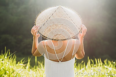 Portrait of young asian woman in traditional balinese straw hat Stock Photo