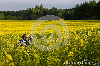 Portrait of young and attractive man in grey blue suit. Stock Photo