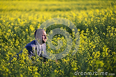 Portrait of young and attractive man in grey blue suit. Stock Photo