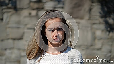 Portrait of a young attractive woman with protective mask in park Stock Photo