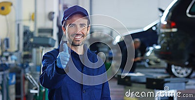 Portrait of a young beautiful car mechanic in a car workshop, in the background of service. Concept: repair of machines, fault dia Stock Photo