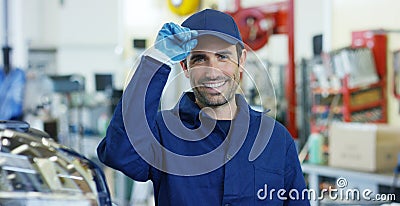 Portrait of a young beautiful car mechanic in a car workshop, in the background of service. Concept: repair of machines, fault dia Stock Photo