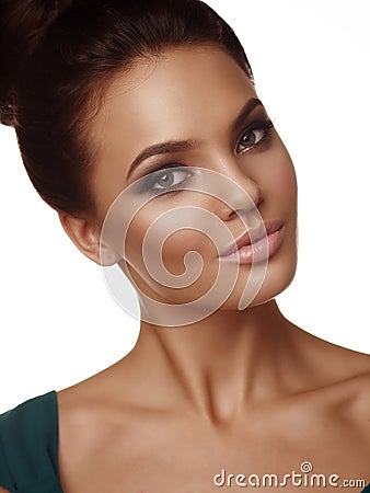 Portrait of a young beautiful girl with collected hair and expressive make up on the white background Stock Photo