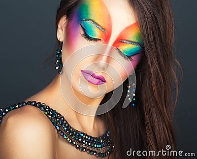 Portrait of a young beautiful girl with a fashion bright multicolored makeup Stock Photo