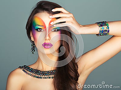 Portrait of a young beautiful girl with a fashion bright multicolored makeup Stock Photo