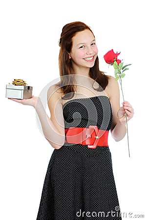 Portrait of a young and beautiful girl with gift and rose isolated on the white background Stock Photo