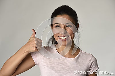 Portrait of young beautiful and happy Latin woman with big toothy smile excited and cheerful Stock Photo