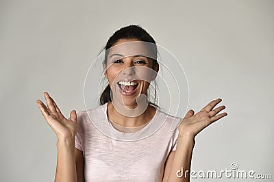 Portrait of young beautiful and happy Latin woman with big toothy smile excited and cheerful Stock Photo