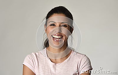 Portrait of young beautiful and happy Latin woman with big toothy smile excited and cheerful Stock Photo