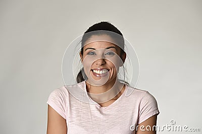 Portrait of young beautiful and happy Latin woman with big toothy smile excited and cheerful Stock Photo