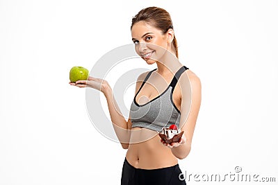 Portrait of young beautiful sportive girl over white background. Stock Photo