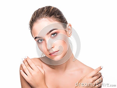 Portrait of young beautiful caucasian woman touching her face isolated over white background. Cleaning face, perfect skin. SPA the Stock Photo