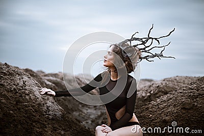 Portrait of young beauty woman with wooden crown. Alien landscape Stock Photo