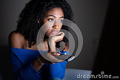 Black girl watching tv series at home Stock Photo