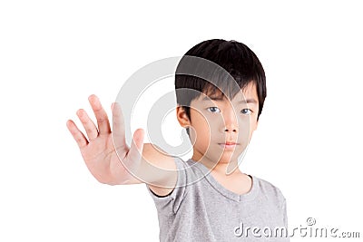 Portrait of a young boy making stop gesture Stock Photo