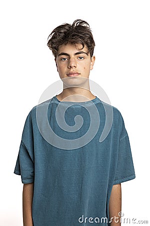 Portrait of teenager on white background in studio. The boy is standing Stock Photo