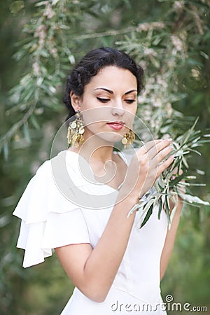 Portrait young bride with brunette hair in white wedding dress a Stock Photo