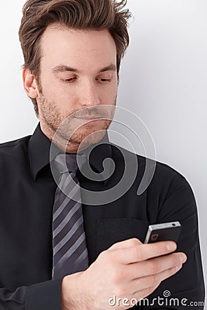 Portrait of young businessman with mobile Stock Photo