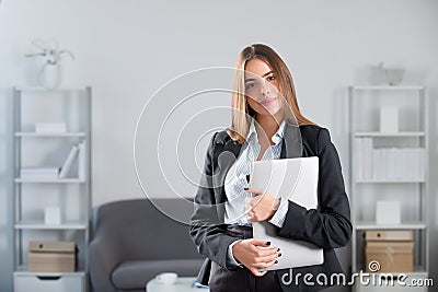 Portrait of young businesswoman accountant in formal wear at office work place. Successful female manager, beautiful Stock Photo