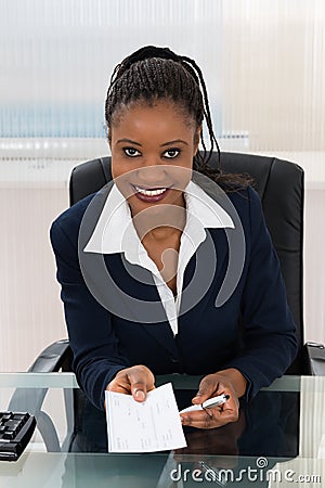 Businesswoman Offering Cheque Stock Photo