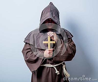 Portrait of Young catholic monk with cross Stock Photo