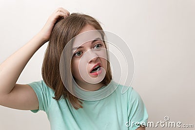 Portrait of young caucasian woman girl with questioning, puzzled, confused, perplexed expression Stock Photo