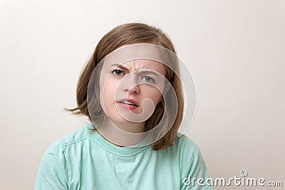 Portrait of young caucasian woman girl with questioning, puzzled, confused, perplexed expression Stock Photo