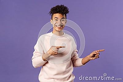 Portrait of young cheerful european guy with dreads, hipster male student inviting join online courses, pay for super Stock Photo