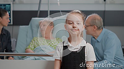 Portrait of young child standing in hospital ward at clinic Stock Photo