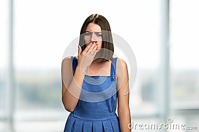 Portrait of young coughing woman. Stock Photo