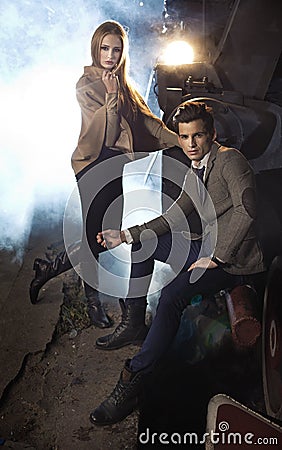 Portrait of young couple next to the engine Stock Photo