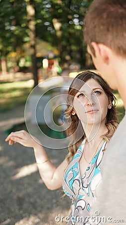 Portrait of a young couples in a summer park Stock Photo