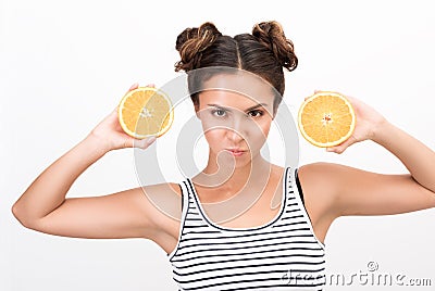 Portrait of a young dynamic woman with two orange slices Stock Photo