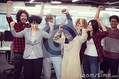 Portrait of young excited multiethnics business team Stock Photo