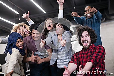 Portrait of young excited multiethnics business team Stock Photo