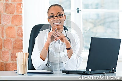 Portrait of young female doctor in clinic Stock Photo