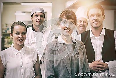 Portrait of young female manager posing in modern kitchen Stock Photo