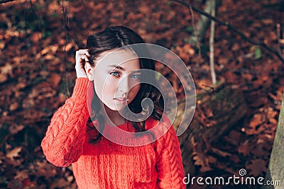 Portrait of young girl with blue eyes in the autumn forest Stock Photo