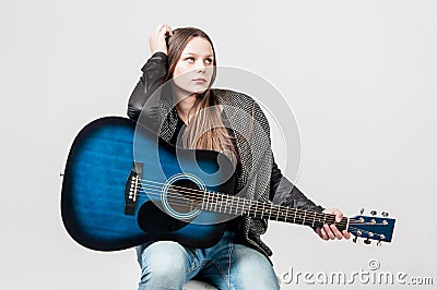 Portrait of young girl with blue guitar Stock Photo