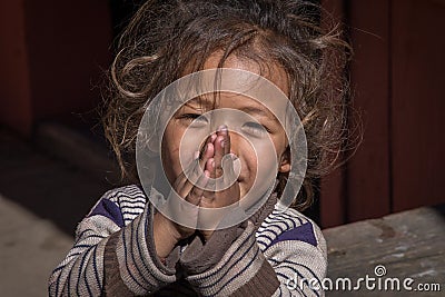 Portrait young girl with folded hands in street, Nepal. Close up Editorial Stock Photo