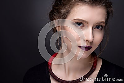 Portrait of a young girl with ornaments from beads. Stock Photo