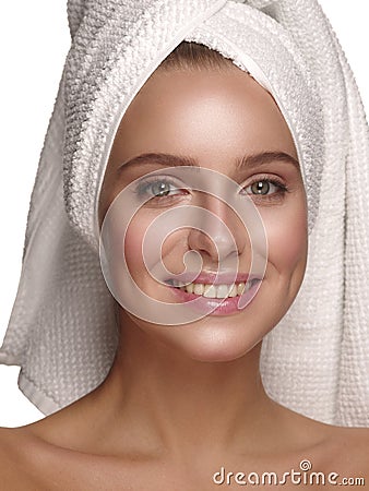 Portrait of a young girl with pure, healthy, smooth and natural glowing skin without any makeup, who is doing daily skincare Stock Photo