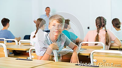 Portrait of young guy student in audience, looking at camera Stock Photo