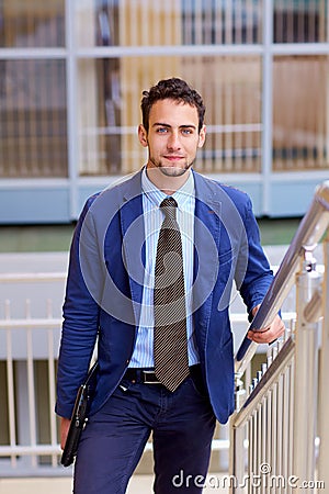 Portrait of a young handsome business man with laptop. Stock Photo