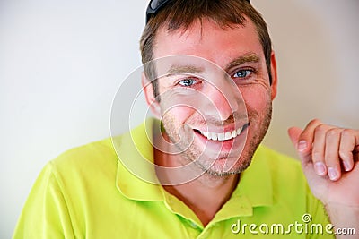 Portrait of young handsome caucasian man smiling and looking at camera Stock Photo